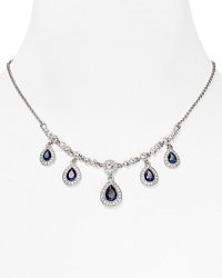 As if taken from a socialite's jewel box, this ornate drop necklace from Carolee flaunts an heirloom quality cast in rhodium plated metal with delicate dangling crystal stations.