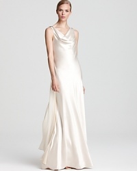 Gilded embellishments and chain details lend edge to a graceful, cowl neck gown from ABS by Allen Schwartz.