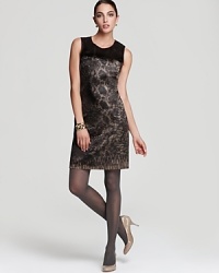 Shimmering snakeskin print enlivens a sleek T Tahari sheath dress for a refined walk on the wild side. Finish the look with metallic pumps and soar to fierce fashion heights.