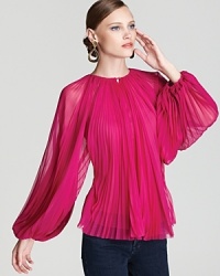 Dramatic accordion pleats add classic flair to this soft-as-silk DIANE von FURSTENBERG top.