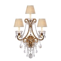 The curved arms, cascading crystals and candle flame-shaped bulbs on this Ralph Lauren sconce will illuminate your decor with unparalleled glamour.