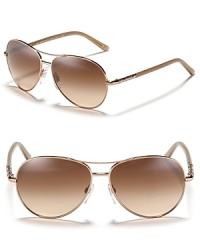 Exude classic cool in these aviator-style shades from Burberry.