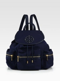 A lightweight nylon style with luxurious leather trim and radiant hardware.Leather top handle, 3½ dropAdjustable shoulder straps, 12-18½ dropMagnetic snap flap closure with drawstringProtective metal feetThree outside zip pocketsOne inside zip pocketTwo inside open pocketsCotton lining12W X 13½H X 5½DImported