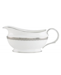 Inspired by the trim on an elegant gown, the graceful Lace Couture gravy boat features an intricate platinum border that combines harmoniously with white bone china for unparalleled style. From Lenox.