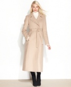 Winter coats have never looked so chic with this wool-blend topper from Calvin Klein. An elegant maxi design and belted waist add feminine flair to your silhouette.