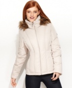 Streamlined vertical quilting gives Calvin Klein's short puffer coat a trim silhouette, while a faux-fur-trimmed hood adds a luxe touch.