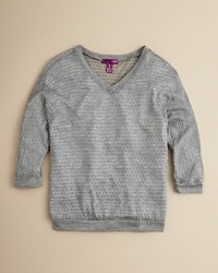 A sparkly metallic top in a fun, honeycomb patterned knit-layer over a bright tee for an extra pop of color.