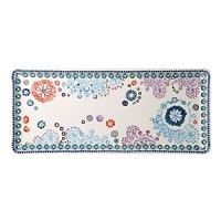 Sultana is a graphic and contemporary design in turquoise, orange, navy, and lavender inspired by laces of the Orient.