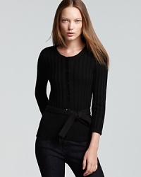 A dark style goes demure as a dainty bow-tie waist crafts a feminine Burberry Brit wool cardigan.