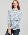 An enchanting floral print enlivens this fresh button-down Theory shirt, rendered in pure silk.