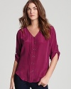 Make a solid statement with this elegant silk-spun Yumi Kim top this fall.