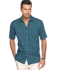 Button up cool style in this plaid shirt from Van Heusen.