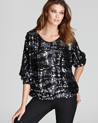 An exotic zebra pattern in shimmering sequins embellishes this Rachel Zoe top for a standout look that turns the sidewalk into a catwalk.