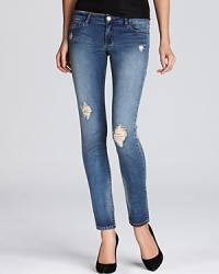 Distressing lends downtown cool to Aqua's skinny jeans--sure to be your favorite weekend go-to.