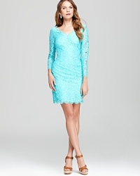 Delicate lace lends romantic inspiration to a classic Lilly Pulitzer dress, finished with sheer sleeves and a scalloped hem for pure feminine charm.