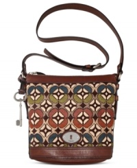 Simple and seriously chic, this cool crossbody from Fossil reels in old school charm with a contemporary attitude. Mod tapestry, leather trim and signature hardware add depth and dimension, while the spacious interior stashes your everyday essentials with ease.