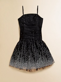 She'll dazzle and delight in this sparkly party dress with a full skirt, shirred bodice and eye-catching embellishments.Straight necklineAdjustable shoulder strapsConcealed back zipperShirred bodiceGathered waistFull skirtFully linedNylon/polyester/spandexDry cleanMade in the USA