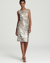 In gilded, gleaming sequins, David Meister's sparkling dress shows off a boat neck front--a chic contrast to an alluring open back.