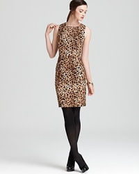 Exotics goes executive as crisp cheetah print enlivens a classic Calvin Klein sheath dress.