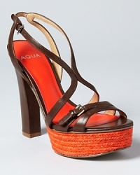 A captivating orange platform infuses instant color into a pair of strappy sandals from Aqua.