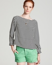 Get all decked out in an Alice + Olivia boat neck top in a luxe stretch silk with boldly patterned stripes.