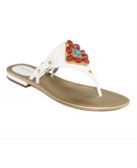 The focal point of fashion. Tahari's Dash flat thong sandals feature a colorful jewel detail at the vamp that will complement any of the season's pretty outfits.