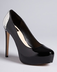 DV Dolce Vita caps off these boldly designed patent platform pumps with metal plates at the back: Make every step shine.