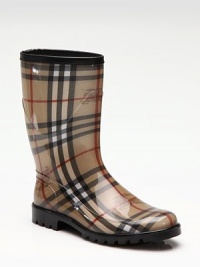 Traditional signature check and prorsum horse-printed fabric are covered in clear rubber for waterproof protection.Rubber heel, 1 (25mm) Shaft, 9¼ Leg circumference, 14 Round toe Leather trim at top Pull-on style Padded insole Rubber lug sole Made in ItalyOUR FIT MODEL RECOMMENDS ordering true whole size; ½ sizes should order the next whole size down. 