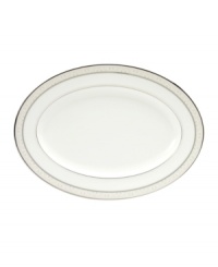 This versatile and stylish oval platter will coordinate perfectly with a variety of table linens and flatware. An ornate scroll motif trimmed in platinum adds a sophisticated sensibility to your tabletop.