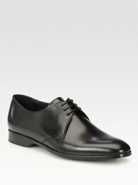 Classic lace-up oxford with a beveled heel, rendered in smooth, supple Italian leather.Leather upperLeather liningPadded insoleRubber soleMade in Italy