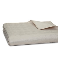 The neat box stitch adorning this luminous satin Hudson Park queen coverlet in a calming, versatile taupe evokes modern simplicity and sophistication.