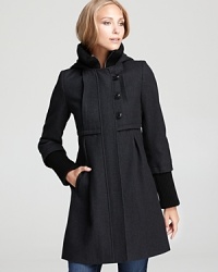 A knit collar and cuffs perfectly accents this babydoll-style DKNY coat, flaunting pretty pleats at the front and back and toggle closures for a charming finish.