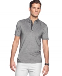 A button-down collar adds some extra polish to this pique polo shirt from Calvin Klein.