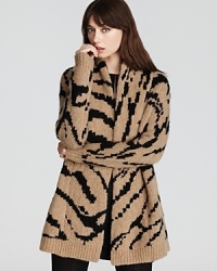 Enliven your everyday style with an oversized Juicy Couture coat accentuated with crisp animal print. Slip the statement layer over leather leggings for a roaring fashion statement.