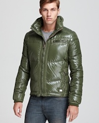 This winter-ready updated take on the down jacket features bright color and a glossy finish. It's hot and super warm.