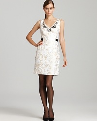 Subtle metallics illuminate a brocade-print Lilly Pulitzer dress, accented with an ornately-embellished neckline for an effortlessly luxe look. Slip the style over sheer tights and captivate at cocktail hour.