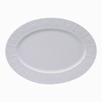 Modern in design with a raised circular pattern, made from French Limoges Porcelain. Dishwasher and microwave safe.