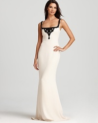 Jet black beading lends a dramatic, sophisticated look to this Badgley Mischka gown, crafted in a timeless, neutral hue.