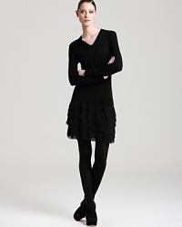 Rolling with ruffles, this DKNY sweater dress infuses your everyday style with youthful joie de vivre. Polish off the playful silhouette with chic black tights.