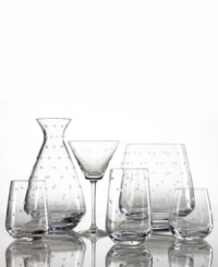 Savor your favorite cocktail with the Larabee Dot martini glass. Etched polka-dots on clear crystal lend elegance to your tabletop. Martini glass shown center.