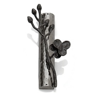 Intricate and alluring, Michael Aram's Black Orchid collection evokes nature at its best. Says the designer, There is a velvety luxury - an almost gothic quality - to representing orchids in blackened nickel. To me, the pieces feel seductive and graceful, yet dark and unexpected.