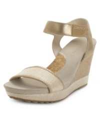 Stylish or sporty? Go for both with the Hera wedge sandals by DKNY Active. Their fabric straps, athletic-inspired details and bouncy cork and mesh heel are a winning combo.