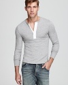 The contrast placket of this masculine henley adds a sporty yet artful touch to your casual cool look.