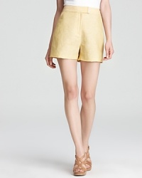 A warm-weather alternative to skirts, these tailored T Tahari shorts spice up your everyday with a fresh lemony hue. Pair with a floaty blouse and lofty wedges for uptown-chic.