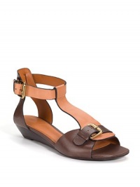 THE LOOKOpen toe with buckle detail Adjustable ankle strapTHE FITStacked wedge heel, 1¼ (30mm)THE MATERIALLeather lining and sole Padded insoleORIGINImportedOUR FIT MODEL RECOMMENDS ordering one half size up as this style runs small. 