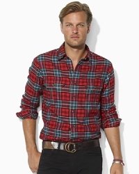 Putting a preppy twist on a conventionally rugged look, this relaxed-fitting plaid shirt is rendered in soft cotton with Ralph Lauren's embroidered pony adorning the chest.