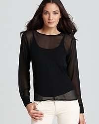 Sleek and simple, Kain Label's blouse in sumptuous silk exudes effortless elegance.