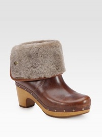 An ultra-soft shearling cuff tops this studded design of rich leather, lifted by a wooden heel. Wooden heel, 3 (75mm)Wooden platform, 1 (25mm)Compares to a 2 heel (50mm)Leather and shearling upperPull-on styleShearling liningRubber solePadded insoleImported