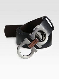 Smooth Italian calfskin leather belt reverses from black to auburn, and is joined together by a double gancini buckle with a wooden insert.LeatherAbout 2 wideMade in Italy