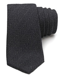 A masterfully understated tie rendered with a herringbone pattern from the always exceptional Theory.